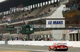 14.10.2006 Le Mans, France,  General view of the Le Mans grnadstand with Bernd Schneider (GER), AMG-Mercedes, AMG-Mercedes C-Klasse driving by. - DTM 2006 at Le Mans Bugatti Circuit, France (Deutsche Tourenwagen Masters)
