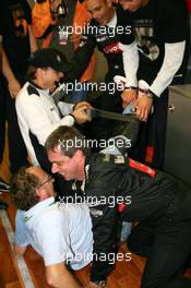 15.10.2006 Le Mans, France,  Gregor "Macky" Messer (GER), journalist of Auto Motor und Sport, being tied up by Mercedes mechanics with Duck tape - DTM 2006 at Le Mans Bugatti Circuit, France (Deutsche Tourenwagen Masters)