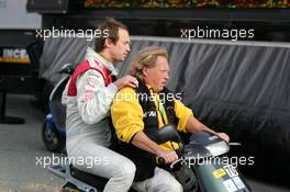 15.10.2006 Le Mans, France,  Frank Stippler (GER), Audi Sport Team Rosberg, Portrait, being brought back to the pits after his crash in the opening lap of the race by photographer Thomas Simons (GER) - DTM 2006 at Le Mans Bugatti Circuit, France (Deutsche Tourenwagen Masters)