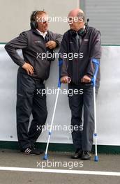 15.10.2006 Le Mans, France,  (right) Dr. Wolfgang Ullrich (GER), Audi's Head of Sport on crutches. - DTM 2006 at Le Mans Bugatti Circuit, France (Deutsche Tourenwagen Masters)