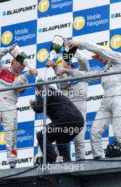 15.10.2006 Le Mans, France,  Gerhard Ungar (GER), Chief Designer AMG (middle) being sprayed with champagne with the top 3 finishers on the podium. - DTM 2006 at Le Mans Bugatti Circuit, France (Deutsche Tourenwagen Masters)