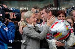 15.10.2006 Le Mans, France,  Svenja Weber (GER), girlfriend of Bernd Schneider (GER), AMG-Mercedes, celebrates her boyfriend with the 2006 DTM championship - DTM 2006 at Le Mans Bugatti Circuit, France (Deutsche Tourenwagen Masters)