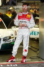 27.10.2006 Hockenheim, Germany,  Heinz-Harald Frentzen (GER), Audi Sport Team Abt Sportsline, Portrait. Putting in his earplugs before the practice session. - DTM 2006 at Hockenheimring (Deutsche Tourenwagen Masters)