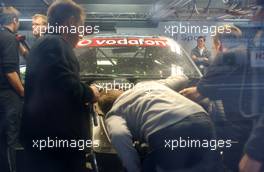 27.10.2006 Hockenheim, Germany,  Frank Stippler (GER), Audi Sport Team Rosberg, Audi A4 DTM went off the track quite hard during the first practice. He had extensive damage on the front of his car. Audi mechanics tried to close down the pitbox from the front and the side to prevent photographers taking pictures. Partly taking pitctures was only possible through the small window of the garage. - DTM 2006 at Hockenheimring (Deutsche Tourenwagen Masters)
