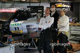 27.10.2006 Hockenheim, Germany,  Alexandros Margaritis (GRC), Persson Motorsport AMG-Mercedes, Portrait, waiting in the pitbox for his car to tbe ready - DTM 2006 at Hockenheimring (Deutsche Tourenwagen Masters)