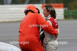 28.10.2006 Hockenheim, Germany,  Vanina Ickx (BEL), Team Midland, Portrait, smiling and talking with a doctor after her crash in the free practice - DTM 2006 at Hockenheimring (Deutsche Tourenwagen Masters)