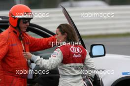 28.10.2006 Hockenheim, Germany,  Vanina Ickx (BEL), Team Midland, Portrait, talking with a doctor after her crash in the free practice - DTM 2006 at Hockenheimring (Deutsche Tourenwagen Masters)