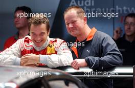 28.10.2006 Hockenheim, Germany,  (left) Timo Scheider (GER), Audi Sport Team Rosberg, Audi A4 DTM having some fun with his personal friend and mental coach in the pitbox before the training. - DTM 2006 at Hockenheimring (Deutsche Tourenwagen Masters)