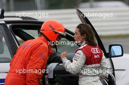 28.10.2006 Hockenheim, Germany,  Vanina Ickx (BEL), Team Midland, Portrait, talking with a doctor after her crash in the free practice - DTM 2006 at Hockenheimring (Deutsche Tourenwagen Masters)