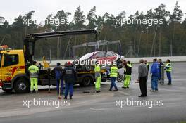 28.10.2006 Hockenheim, Germany,  Marshalls loading the car of Vanina Ickx (BEL), Team Midland, Audi A4 DTM, on a truck, after her crash during free practice - DTM 2006 at Hockenheimring (Deutsche Tourenwagen Masters)