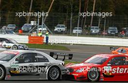 29.10.2006 Hockenheim, Germany,  Close fighting at the Spitzkehre by Jean Alesi (FRA), Persson Motorsport AMG-Mercedes, AMG-Mercedes C-Klasse and Mika Häkkinen (FIN), AMG-Mercedes, AMG-Mercedes C-Klasse. Alesi drove into the backside of the car of Häkkinen and caused minor damage. - DTM 2006 at Hockenheimring (Deutsche Tourenwagen Masters)