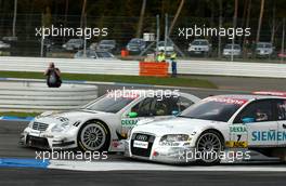 29.10.2006 Hockenheim, Germany,  Close racing with Tom Kristensen (DNK), Audi Sport Team Abt Sportsline, Audi A4 DTM and Jamie Green (GBR), AMG-Mercedes, AMG-Mercedes C-Klasse - DTM 2006 at Hockenheimring (Deutsche Tourenwagen Masters)
