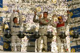 29.10.2006 Hockenheim, Germany,  Top 3 finishers of the 2006 DTM championship: Bernd Schneider (GER), AMG-Mercedes, Portrait (1st, center), Bruno Spengler (CDN), AMG-Mercedes, Portrait (2nd, left) and Tom Kristensen (DNK), Audi Sport Team Abt Sportsline, Portrait (3rd, right) - DTM 2006 at Hockenheimring (Deutsche Tourenwagen Masters)