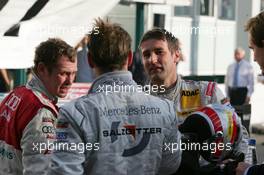 29.10.2006 Hockenheim, Germany,  Tom Kristensen (DNK), Audi Sport Team Abt Sportsline, Portrait (3rd, left), Jamie Green (GBR), AMG-Mercedes (2nd, seen on the back) and Bernd Schneider (GER), AMG-Mercedes, Portrait (champion 2006, right) - DTM 2006 at Hockenheimring (Deutsche Tourenwagen Masters)