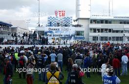 29.10.2006 Hockenheim, Germany,  After the finish of the DTM cars the crowd and fans took posession of the straight to witness the podium ceremony and cheer for their idols. - DTM 2006 at Hockenheimring (Deutsche Tourenwagen Masters)