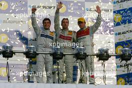 29.10.2006 Hockenheim, Germany,  Top 3 finishers of the 2006 DTM championship: Bernd Schneider (GER), AMG-Mercedes, Portrait (1st, center), Bruno Spengler (CDN), AMG-Mercedes, Portrait (2nd, left) and Tom Kristensen (DNK), Audi Sport Team Abt Sportsline, Portrait (3rd, right) - DTM 2006 at Hockenheimring (Deutsche Tourenwagen Masters)
