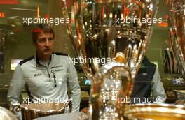 28.08.2006 Amsterdam, The Netherlands,  Bernd Schneider (GER), AMG-Mercedes, AMG-Mercedes C-Klasse admiring some of the Ajax soccers trophys from the past. - DTM 2006 in Amsterdam, The Netherlands (Deutsche Tourenwagen Masters)