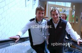 28.08.2006 Amsterdam, The Netherlands,  (left) Bernd Schneider (GER), AMG-Mercedes, AMG-Mercedes C-Klasse and (right) Timo Scheider (GER), Audi Sport Team Rosberg, Audi A4 DTM on the staircase to the pressroom of the Ajax soccerteam. - DTM 2006 in Amsterdam, The Netherlands (Deutsche Tourenwagen Masters)