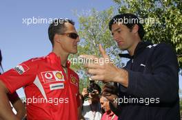30.03.2006 Melbourne, Australia,  Michael Schumacher (GER), Scuderia Ferrari and Mark Webber (AUS), Williams F1 Team - Formula 1 World Championship, Rd 3, Australian Grand Prix, Thursday