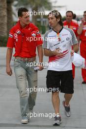 10.03.2006 Sakhir, Bahrain,  Michael Schumacher (GER), Scuderia Ferrari and Jarno Trulli (ITA), Toyota Racing - Formula 1 World Championship, Rd 1, Bahrain Grand Prix, Friday