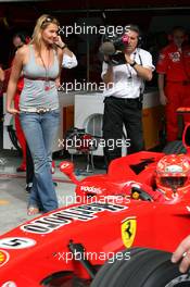 10.03.2006 Sakhir, Bahrain,  ex. swimming champion Franziska van Almsick works now for the RTL -Team here in the Ferrari Garage / Michael Schumacher (GER), Scuderia Ferrari  - Formula 1 World Championship, Rd 1, Bahrain Grand Prix, Friday