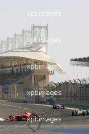 12.03.2006 Sakhir, Bahrain,  Michael Schumacher (GER), Scuderia Ferrari, 248 F1 leads Fernando Alonso (ESP), Renault F1 Team, R26 - Formula 1 World Championship, Rd 1, Bahrain Grand Prix, Sunday Race