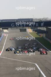 12.03.2006 Sakhir, Bahrain,  Michael Schumacher (GER), Scuderia Ferrari, 248 F1 leads the start of the race - Formula 1 World Championship, Rd 1, Bahrain Grand Prix, Sunday Race