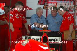 11.03.2006 Sakhir, Bahrain,  Charlie Whiting (GBR), FIA safety delegate, Race director & offical starter and FIA technical delegates are visiting the FERRARI garage to look at their rear wing - Ross Brawn (GBR), Scuderia Ferrari, Technical Director  Formula 1 World Championship, Rd 1, Bahrain Grand Prix, Saturday