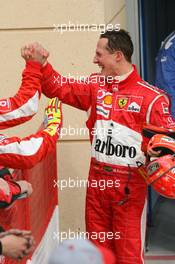 11.03.2006 Sakhir, Bahrain,  Michael Schumacher (GER), Scuderia Ferrari and Felipe Massa (BRA), Scuderia Ferrari congratulate each other - Formula 1 World Championship, Rd 1, Bahrain Grand Prix, Saturday Qualifying