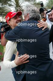 11.03.2006 Sakhir, Bahrain,  Michael Schumacher (GER), Scuderia Ferrari celebrates pole with Willi Weber (GER), Driver Manager - Formula 1 World Championship, Rd 1, Bahrain Grand Prix, Saturday