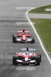 25.06.2006 Montreal, Canada,  Jarno Trulli (ITA), Toyota Racing, TF106, Michael Schumacher (GER), Scuderia Ferrari, 248 F1 - Formula 1 World Championship, Rd 9, Canadian Grand Prix, Sunday Race