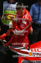 24.06.2006 Montreal, Canada,  Michael Schumacher (GER), Scuderia Ferrari looks at his rear wing - Formula 1 World Championship, Rd 9, Canadian Grand Prix, Saturday Qualifying