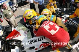 22.06.2006 Montreal, Canada,  Marshalls practice extracting from a car - Formula 1 World Championship, Rd 9, Canadian Grand Prix, Thursday