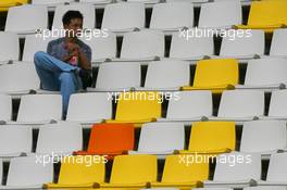 29.09.2006 Shanghai, China,  A fan in the grandstand - Formula 1 World Championship, Rd 16, Chinese Grand Prix, Friday Practice
