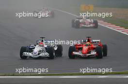 01.10.2006 Shanghai, China,  Robert Kubica (POL), BMW Sauber F1 Team, F1.06, passes Felipe Massa (BRA), Scuderia Ferrari, 248 F1 - Formula 1 World Championship, Rd 16, Chinese Grand Prix, Sunday Race