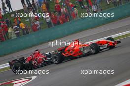 01.10.2006 Shanghai, China,  Tiago Monteiro (POR), Spyker MF1 Racing, Toyota M16 passes Scott Speed (USA), Scuderia Toro Rosso, STR01 - Formula 1 World Championship, Rd 16, Chinese Grand Prix, Sunday Race