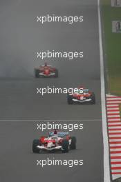 01.10.2006 Shanghai, China,  Jarno Trulli (ITA), Toyota Racing, TF106 and Ralf Schumacher (GER), Toyota Racing, TF106 - Formula 1 World Championship, Rd 16, Chinese Grand Prix, Sunday Race