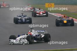 01.10.2006 Shanghai, China,  Robert Kubica (POL), BMW Sauber F1 Team, F1.06, David Coulthard (GBR), Red Bull Racing, RB2 - Formula 1 World Championship, Rd 16, Chinese Grand Prix, Sunday Race