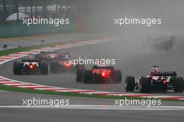 01.10.2006 Shanghai, China,  Takuma Sato (JPN), Super Aguri F1, SA06 and Felipe Massa (BRA), Scuderia Ferrari, 248 F1 - Formula 1 World Championship, Rd 16, Chinese Grand Prix, Sunday Race