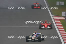 01.10.2006 Shanghai, China,  Rubens Barrichello (BRA), Honda Racing F1 Team, RA106 and Michael Schumacher (GER), Scuderia Ferrari, 248 F1  - Formula 1 World Championship, Rd 16, Chinese Grand Prix, Sunday Race