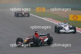 01.10.2006 Shanghai, China,  Scott Speed (USA), Scuderia Toro Rosso, STR01 and Nick Heidfeld (GER), BMW Sauber F1 Team, F1.06 - Formula 1 World Championship, Rd 16, Chinese Grand Prix, Sunday Race