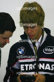 30.09.2006 Shanghai, China,  Sebastian Vettel (GER), Test Driver, BMW Sauber F1 Team, uses Kangeroo TV - Formula 1 World Championship, Rd 16, Chinese Grand Prix, Saturday Practice