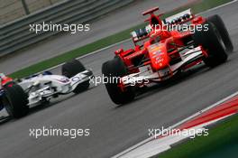 30.09.2006 Shanghai, China,  Michael Schumacher (GER), Scuderia Ferrari, 248 F1 and Robert Kubica (POL), BMW Sauber F1 Team, F1.06 - Formula 1 World Championship, Rd 16, Chinese Grand Prix, Saturday Qualifying