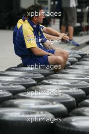 28.09.2006 Shanghai, China,  A Honda team member prepares the teams tyres for the weekend - Formula 1 World Championship, Rd 16, Chinese Grand Prix, Thursday
