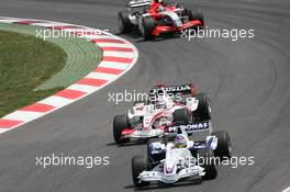 14.05.2006 Granollers, Spain,  Jacques Villeneuve (CDN), BMW Sauber F1 Team, F1.06 leads Takuma Sato (JPN), Super Aguri F1, SA05 - Formula 1 World Championship, Rd 6, Spanish Grand Prix, Sunday Race
