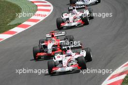 14.05.2006 Granollers, Spain,  Felipe Massa (BRA), Scuderia Ferrari, 248 F1 leads Tiago Monteiro (POR), Midland MF1 Racing, Toyota M16 - Formula 1 World Championship, Rd 6, Spanish Grand Prix, Sunday Race
