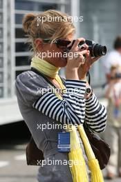 14.05.2006 Granollers, Spain,  A girl in the paddock takes a photo - Formula 1 World Championship, Rd 6, Spanish Grand Prix, Sunday