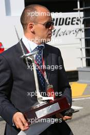 14.05.2006 Granollers, Spain,  A man brings the Formula 1 winners trophy into the Formula 1 Paddock - Formula 1 World Championship, Rd 6, Spanish Grand Prix, Sunday