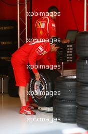 11.05.2006 Granolles, Spain,  A Ferrari Mechanic with Bridgestone tyres - Formula 1 World Championship, Rd 6, Spanish Grand Prix, Thursday