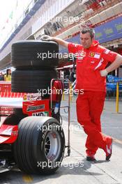 11.05.2006 Granolles, Spain,  A Ferrari Mechanic & the Ferrari of Michael Schumacher (GER), Scuderia Ferrari - Formula 1 World Championship, Rd 6, Spanish Grand Prix, Thursday